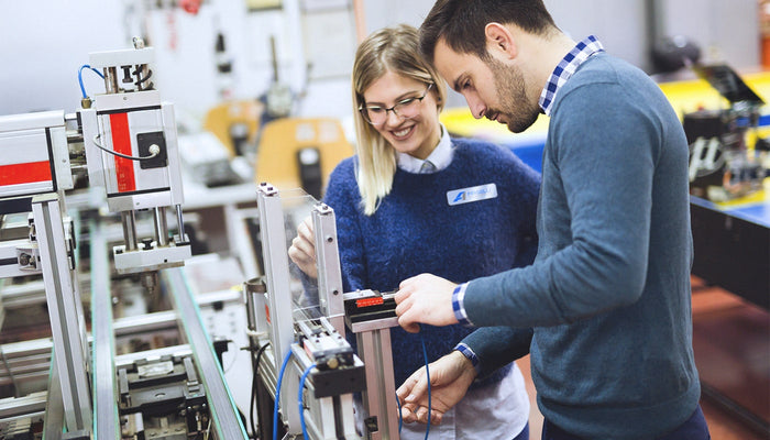 People maintaining equipment